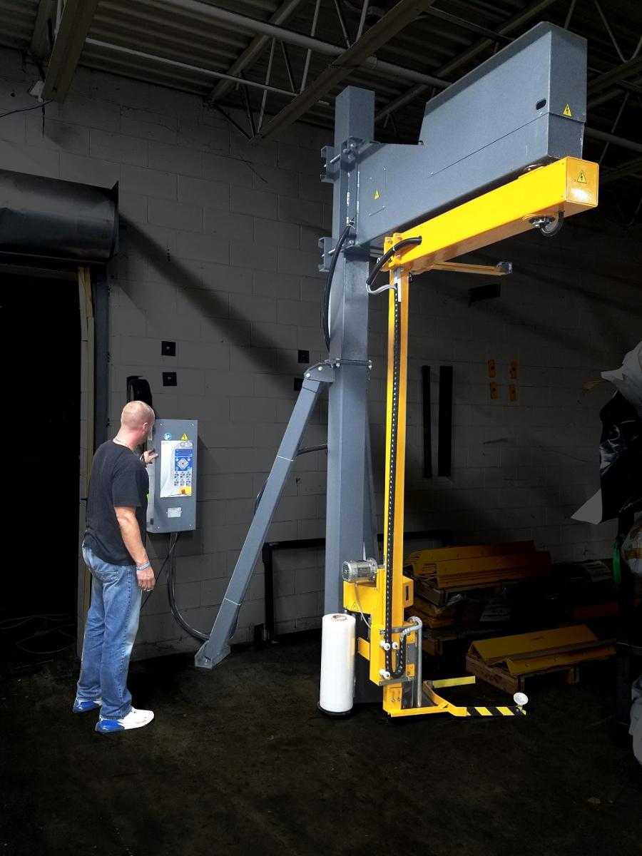 A highlighted photo of a warehouse operating using a Model 2200 rotating shrink wrap machine.