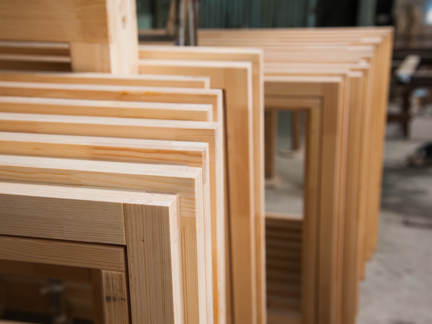 doors and windows leaning on their side waiting to be stretch wrapped for storage and transport