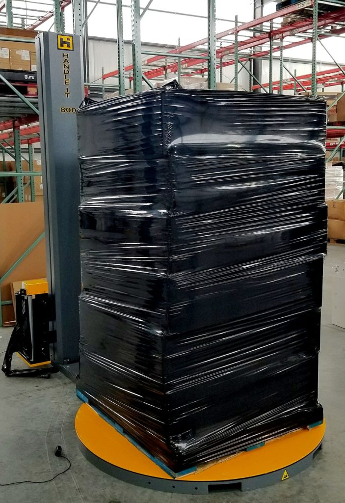 Senstive material in black wrapping on pallet wrapper