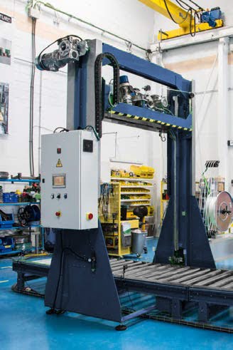 The vertical pallet strapping machines by Handle It secure products to pallets for safe transport.