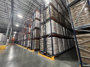 Comparing Plastic and Steel Warehouse Protection: Cost, Durability, and Risk