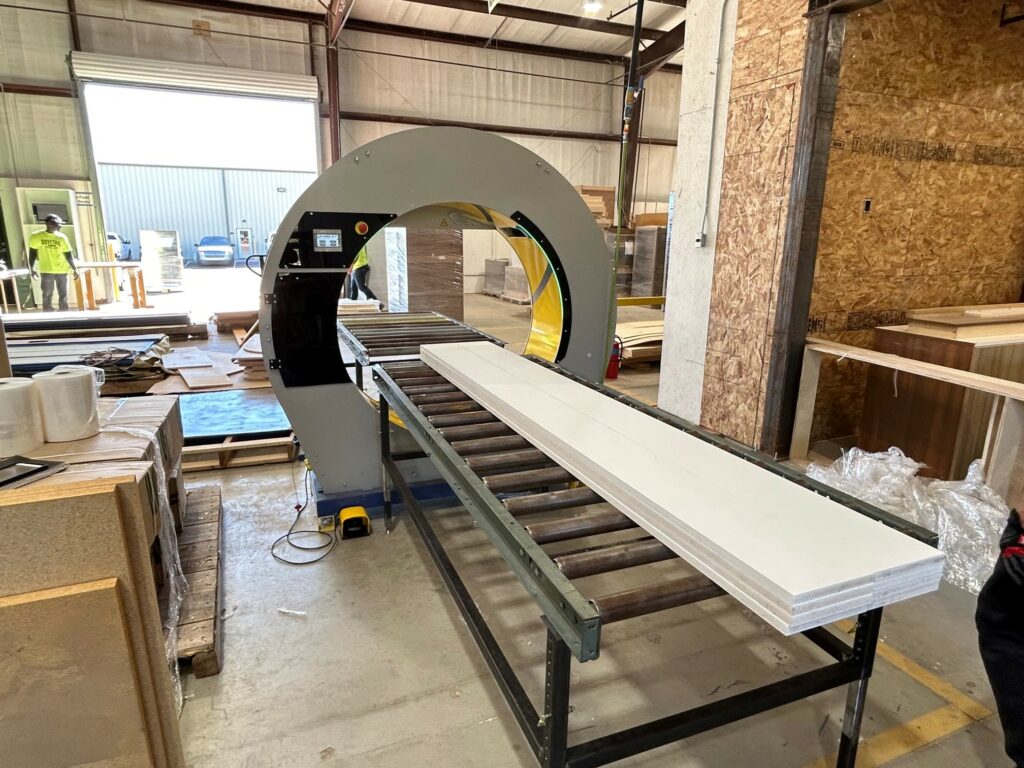 Wood getting wrapped by an orbital wrapper