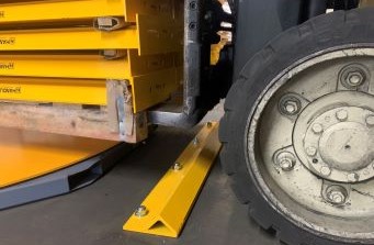 Yellow forklift wheel stop